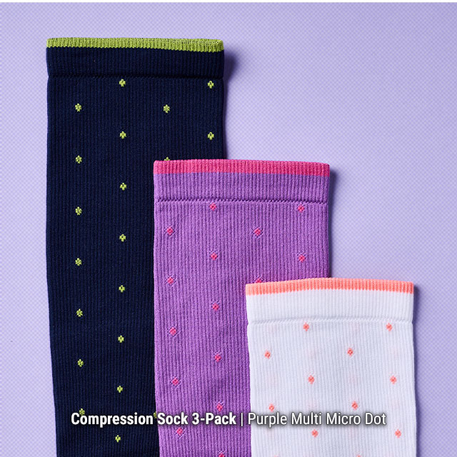 Compression Sock 3-Pack | Purple Multi Micro Dot. 3 compression socks in purple, staggered at different heights on a purple background.